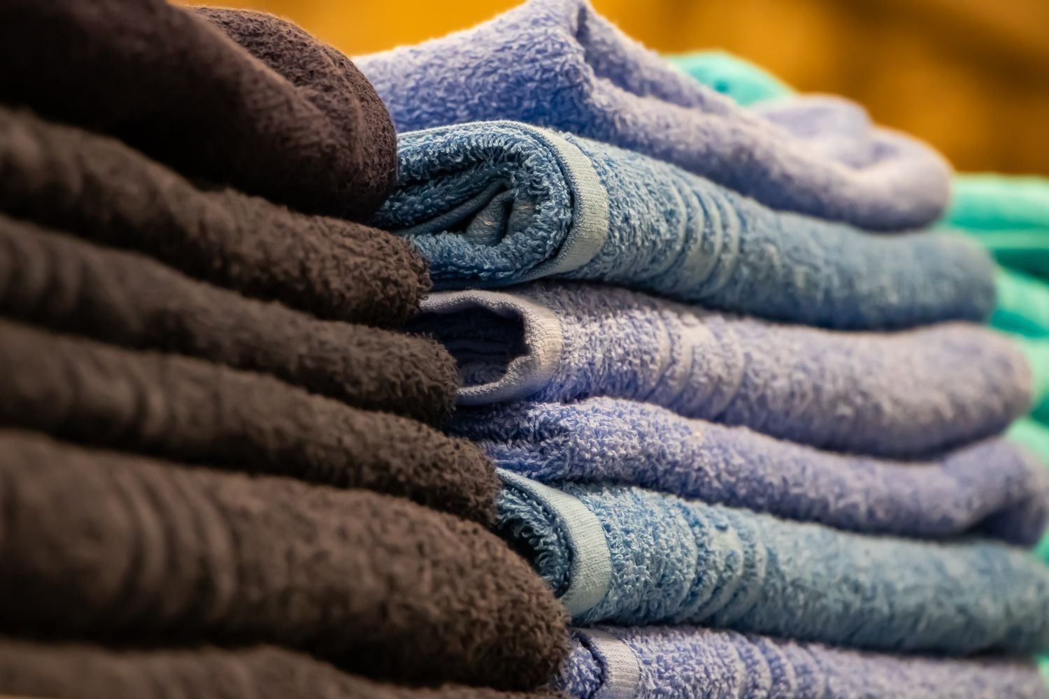 Freshly folded towels prepared for professional wash and fold laundry service