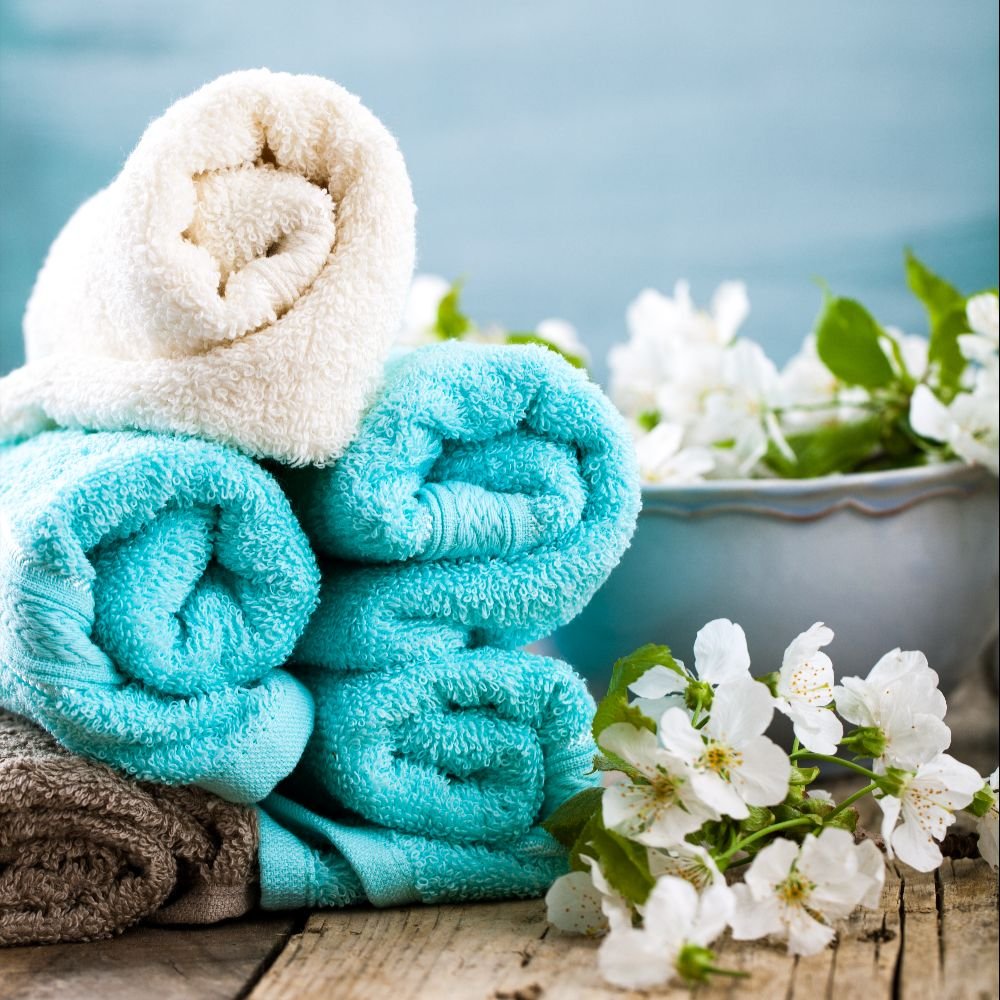 Clean rolled spa towels for salon and wellness commercial laundry service